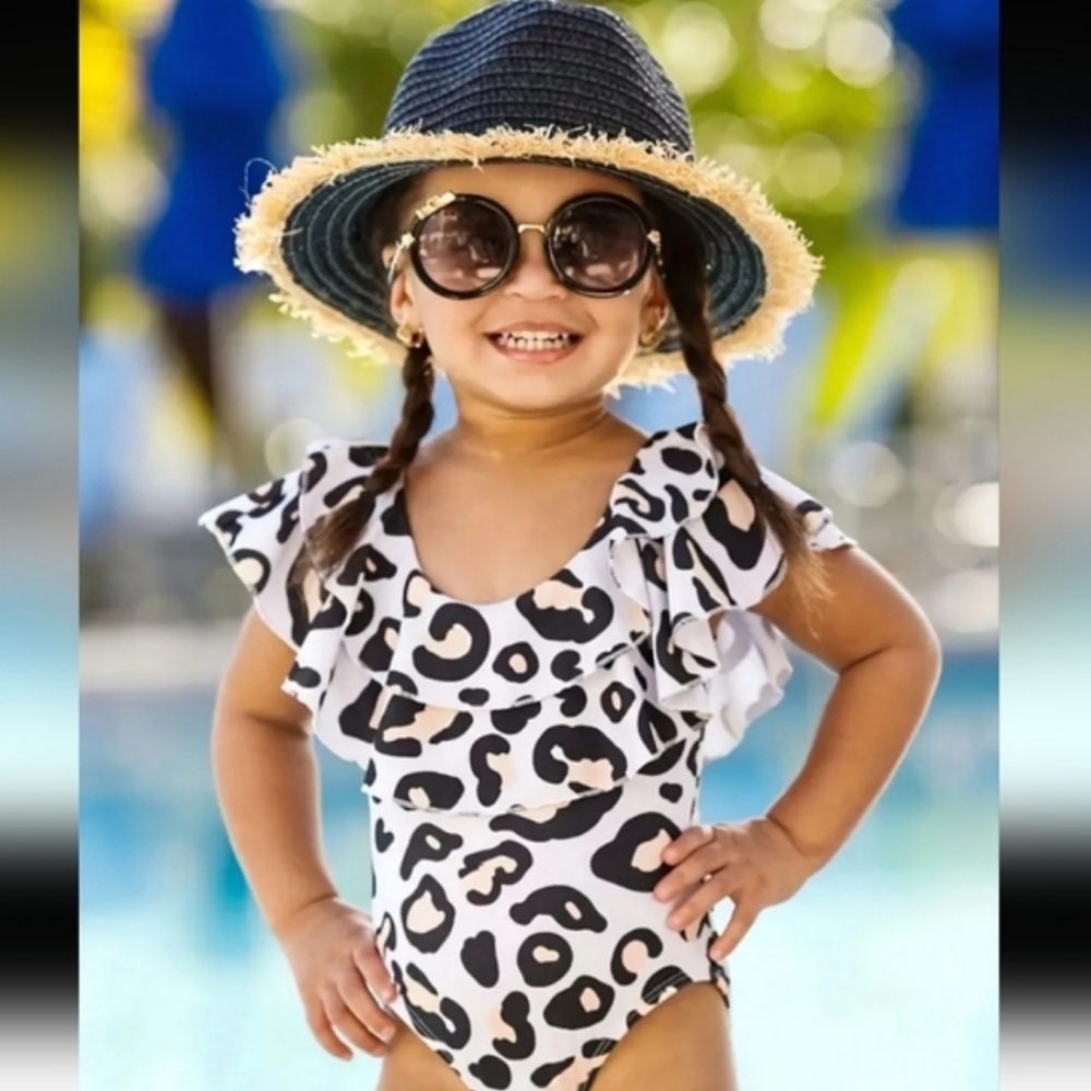 Girls Swimsuit Leopard print, Ruffle trim, One piece. Size 4-5 years.
